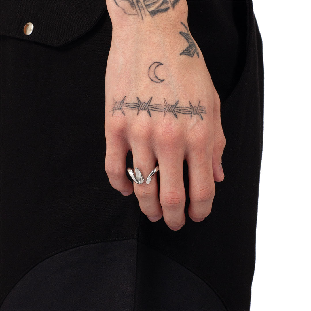 EQUINOX RING worn on a man's hand