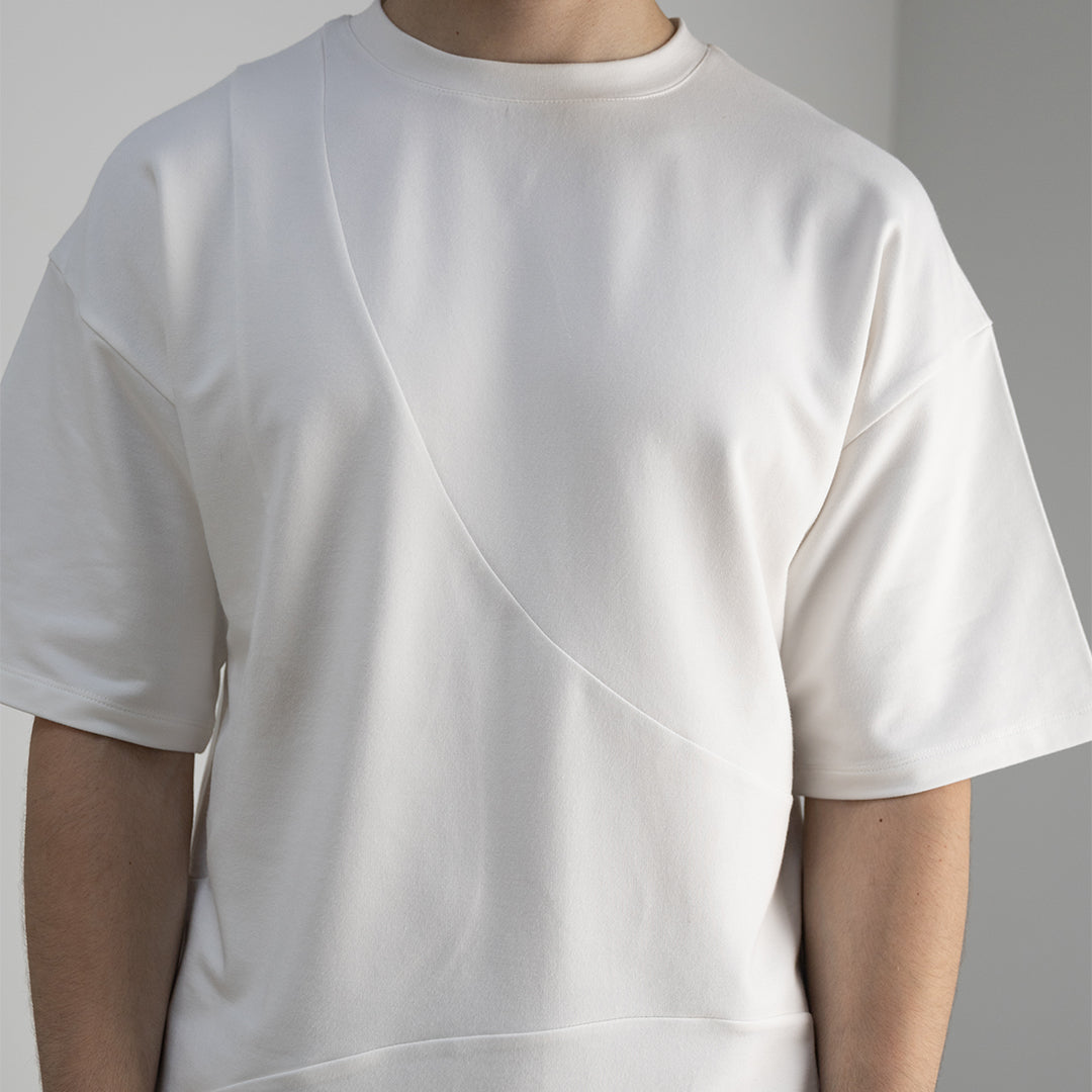 Detail front view of our cropped unisex t-shirt with pattern overlay in color cream. 