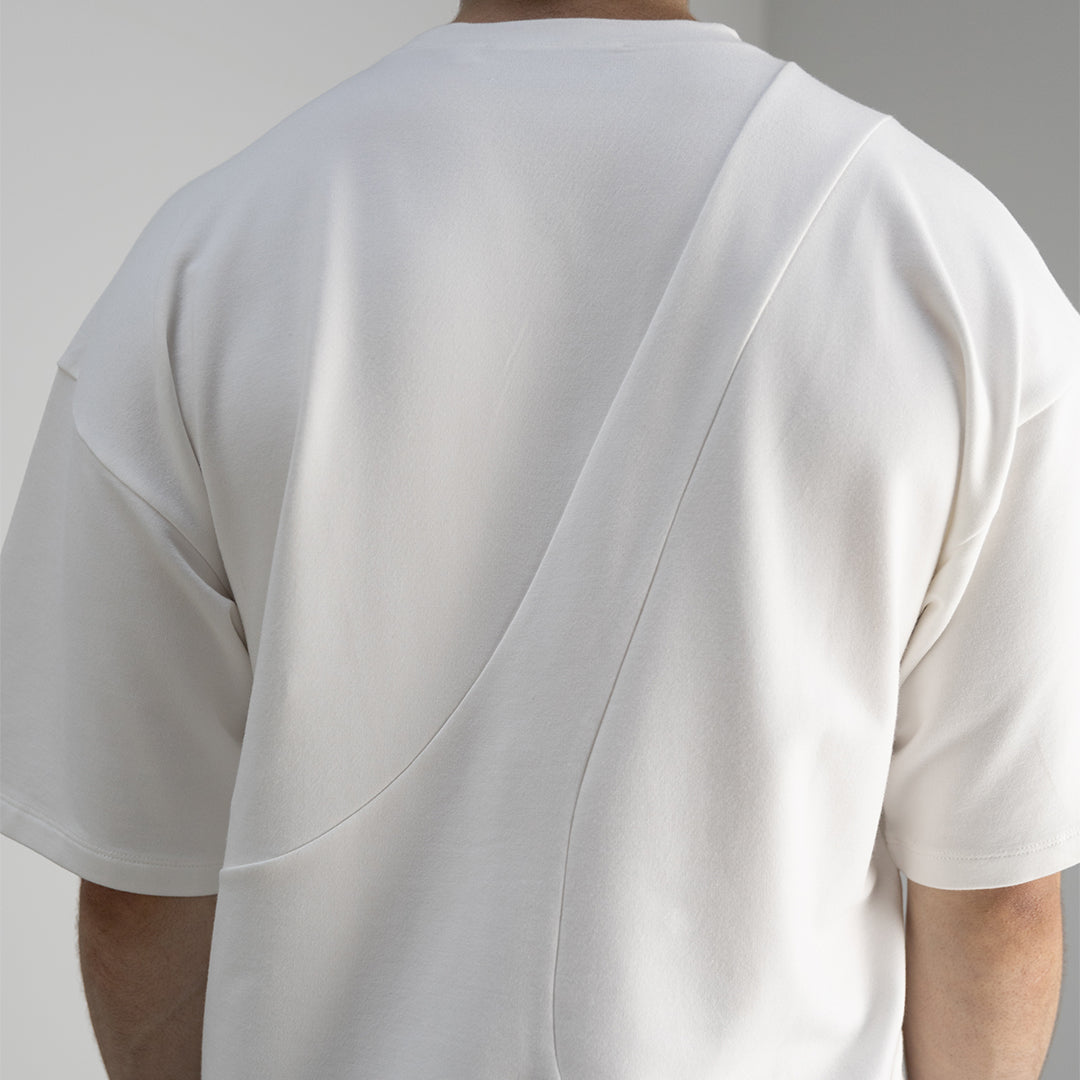 Detail back view of our cropped unisex t-shirt with pattern overlay in color cream. 